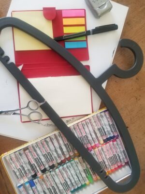 hanger with post its and oil pastels