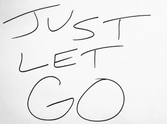 A handwritten message saying Just Let Go